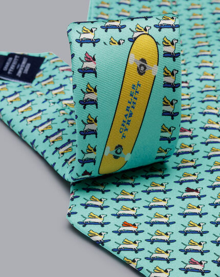 Krawatte aus Seide mit Hund-auf-Skateboard-Motiv - Petrolgrün