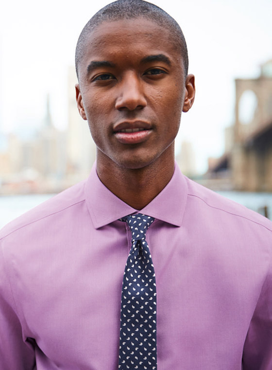 model wearing a pink non-iron shirt