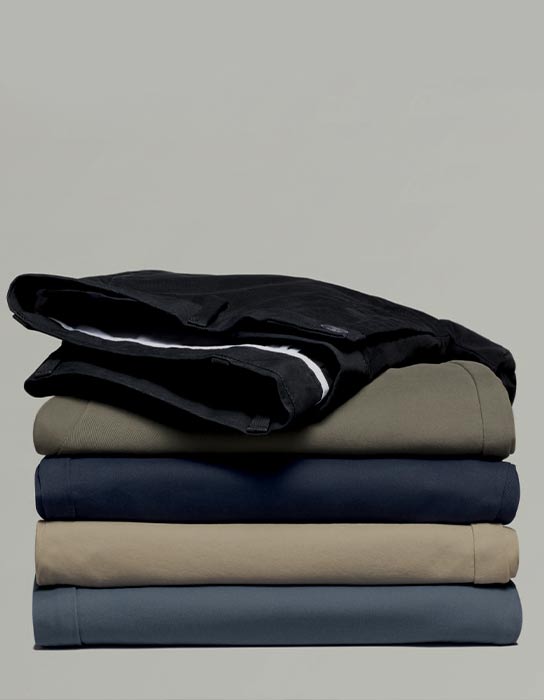 Stack of lightweight chino trousers