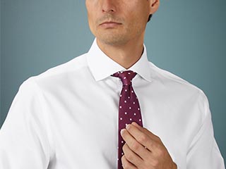 Man in white shirt and burgundy tie
